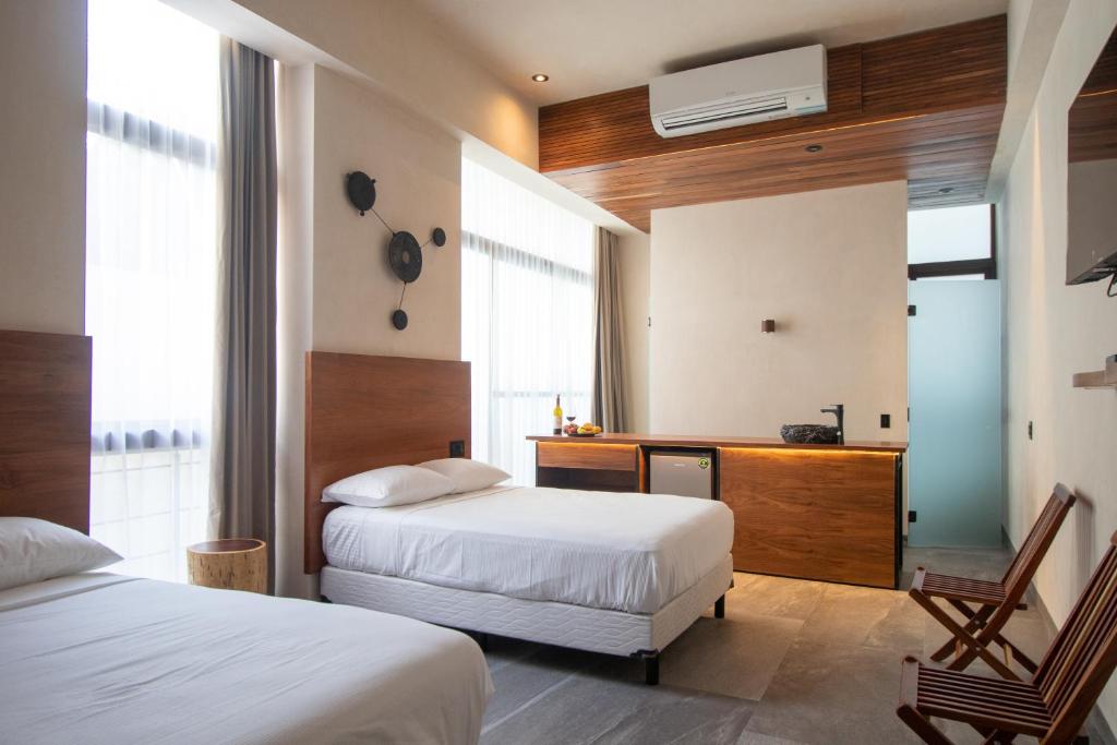 Кровать или кровати в номере Prana Boutique Hotel Tulum