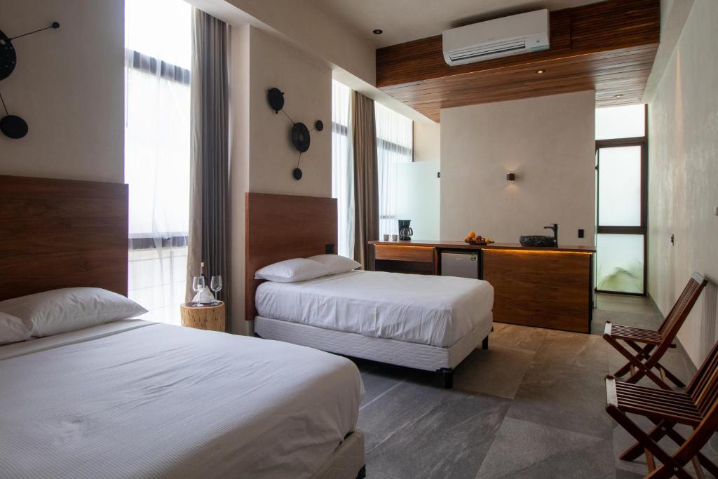 Кровать или кровати в номере Prana Boutique Hotel Tulum