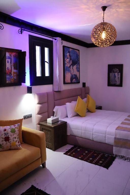 Postel nebo postele na pokoji v ubytování Riad El Palacio & Spa Chaouen