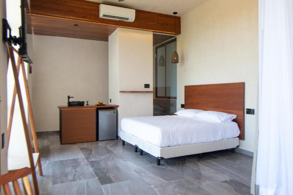 Кровать или кровати в номере Prana Boutique Hotel Tulum