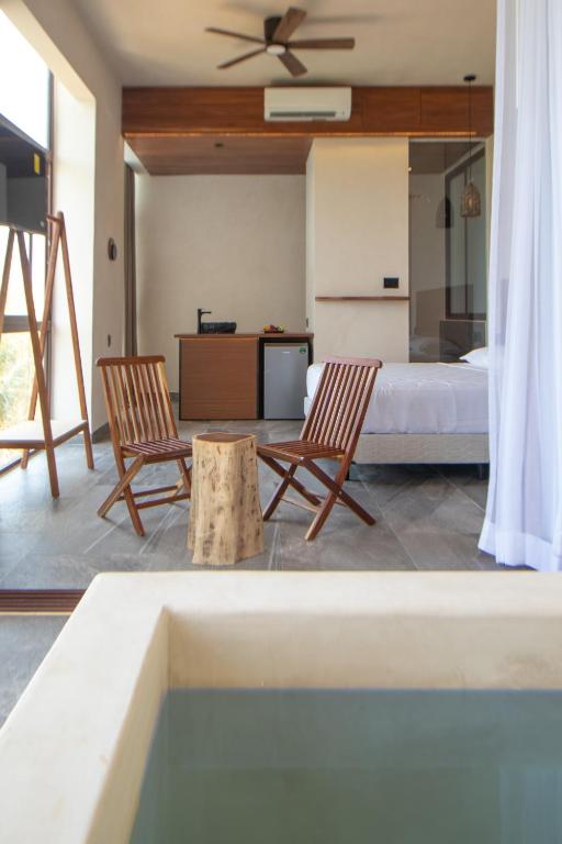 Телевизор и/или развлекательный центр в Prana Boutique Hotel Tulum