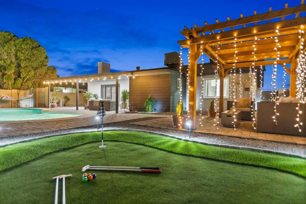 a miniature golf course in the backyard of a house at El Descanso in Meyer Park - Heated Pool in Tempe