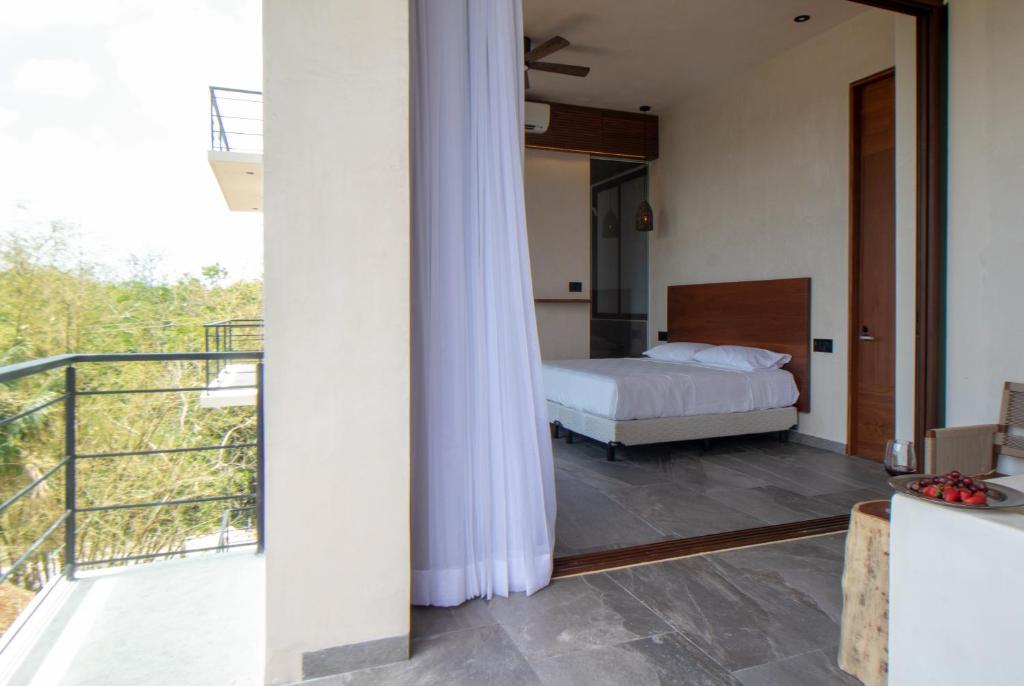 Кровать или кровати в номере Prana Boutique Hotel Tulum