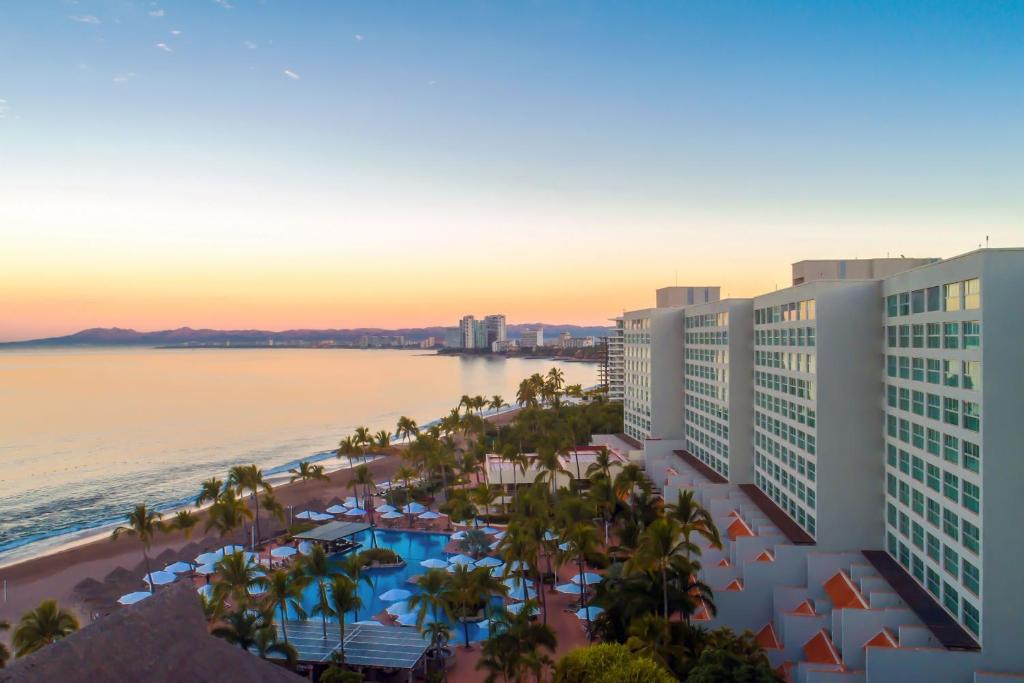 an aerial view of the hotel and the ocean at sunset at Sheraton Buganvilias Resort & Convention Center in Puerto Vallarta