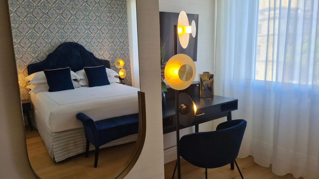 Postel nebo postele na pokoji v ubytování Jolly Charme Suite