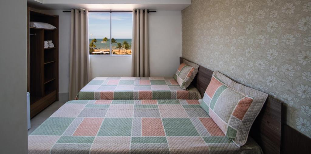 Cama ou camas em um quarto em Tambau Beach Hotel