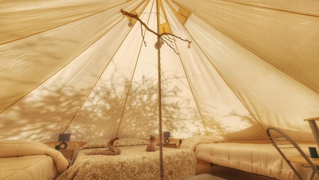 Postel nebo postele na pokoji v ubytování Glamping Dunas del sol