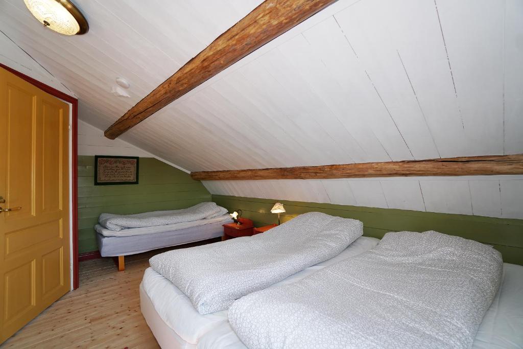 Postel nebo postele na pokoji v ubytování Mittjas Vallen Timber Lodge & Cabins