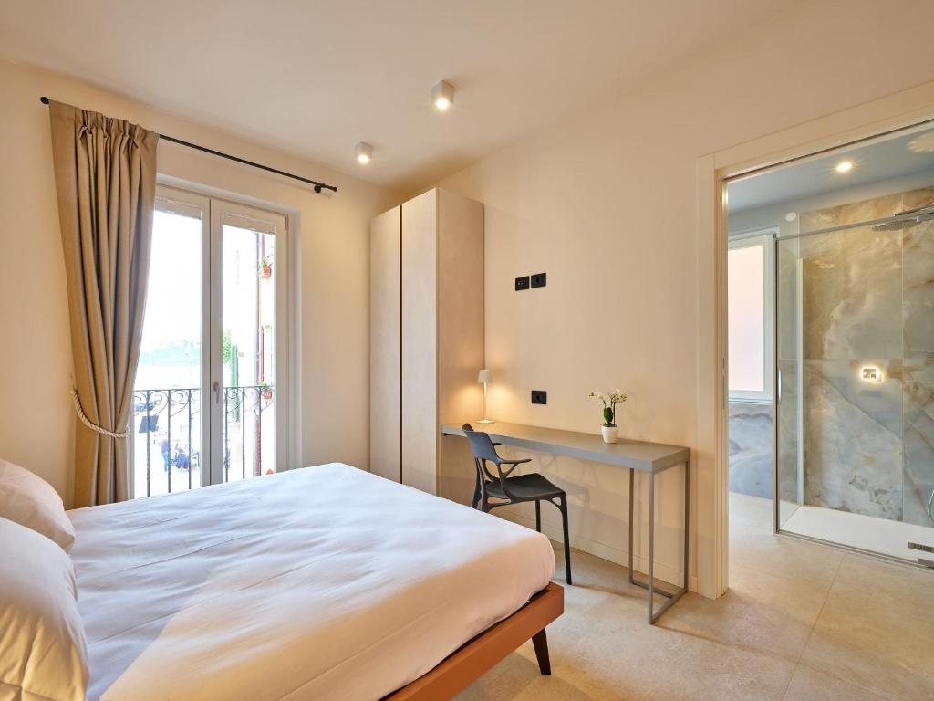 Postel nebo postele na pokoji v ubytování Piccolo Hotel