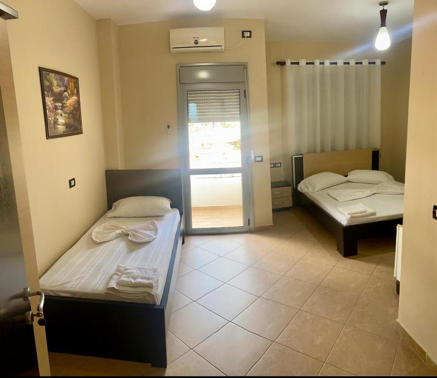 Postel nebo postele na pokoji v ubytování AL Hotel