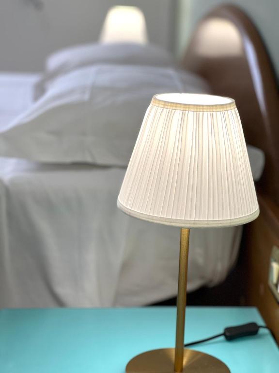Postel nebo postele na pokoji v ubytování Hotel Minerva