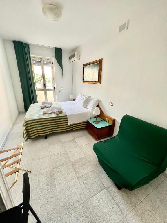 Postel nebo postele na pokoji v ubytování Hotel Minerva