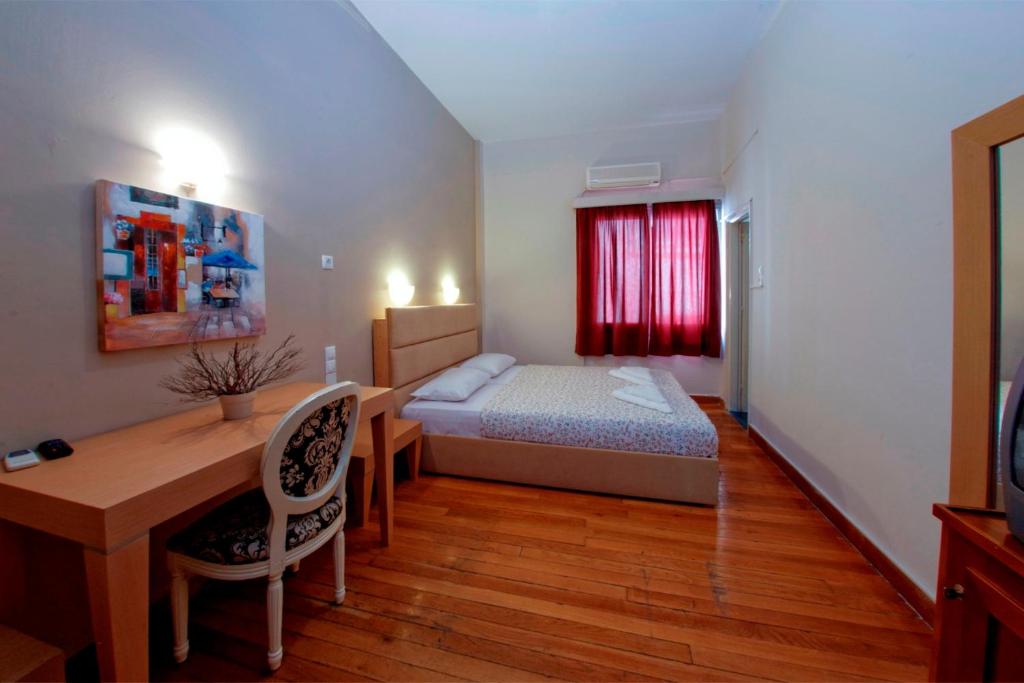Postel nebo postele na pokoji v ubytování Vassilikon Hotel