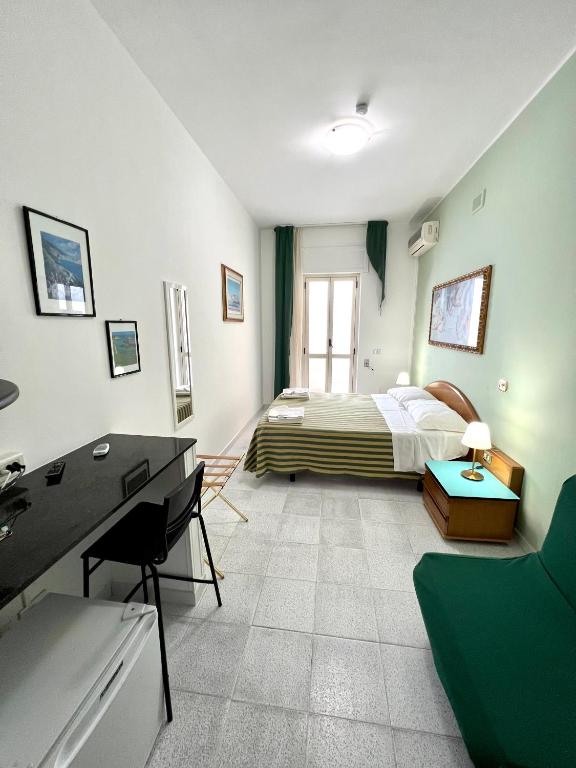 Postel nebo postele na pokoji v ubytování Hotel Minerva