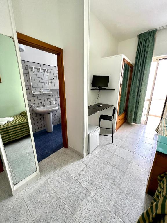TV a/nebo společenská místnost v ubytování Hotel Minerva