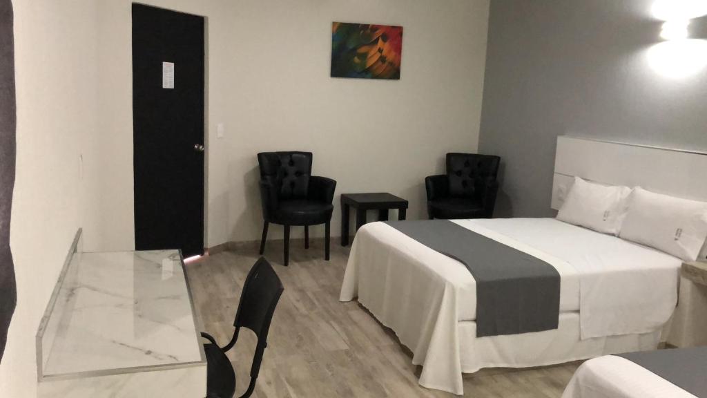Postel nebo postele na pokoji v ubytování Hotel Gallo