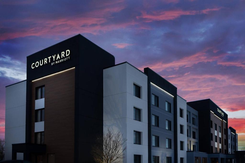 a building with a sign on the side of it at Courtyard by Marriott Buffalo Amherst/University in Amherst