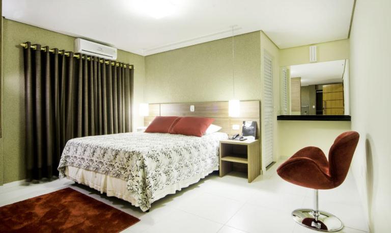 Ένα ή περισσότερα κρεβάτια σε δωμάτιο στο ROMA'S HOTEL