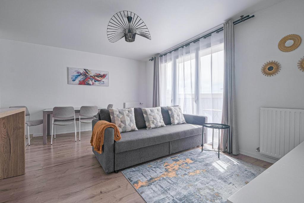 Χώρος καθιστικού στο Coco - Appartement F4 à 10 minutes de Disneyland Paris