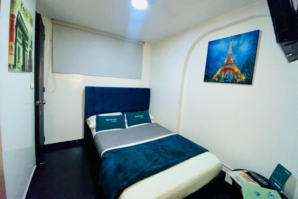 Postel nebo postele na pokoji v ubytování Hotel Bogota Home