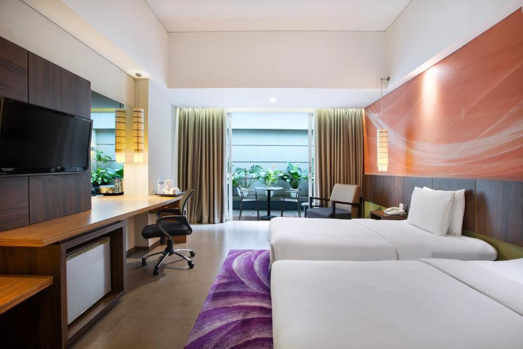 Postel nebo postele na pokoji v ubytování Holiday Inn Bandung Pasteur by IHG