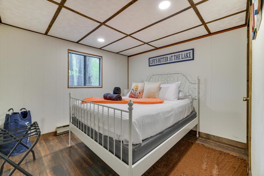 a bedroom with a crib in a room at Hot Tub and Resort Amenities Pocono Lake Retreat! in Pocono Lake