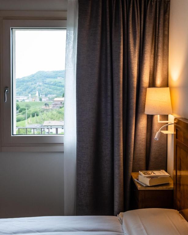 Ein Bett oder Betten in einem Zimmer der Unterkunft Agriturismo al Comarel