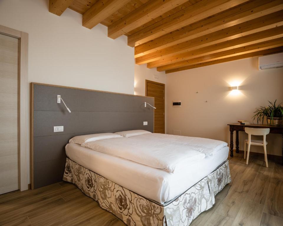Ein Bett oder Betten in einem Zimmer der Unterkunft Agriturismo al Comarel