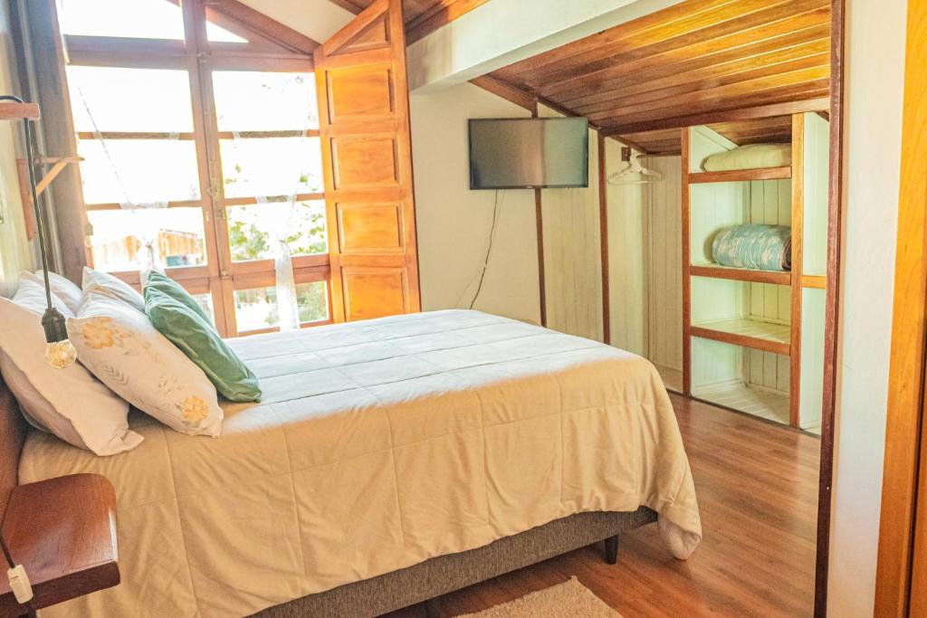 Postel nebo postele na pokoji v ubytování Pousada Casarão do Vale dos Vinhedos