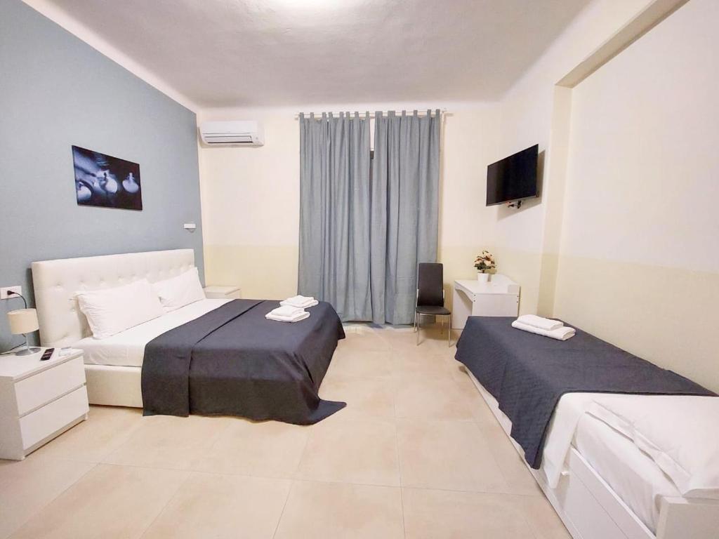 Postel nebo postele na pokoji v ubytování Bonaini Relax B&B