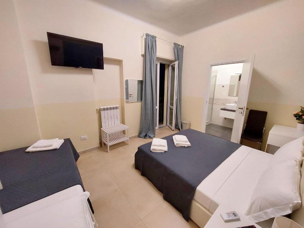 Postel nebo postele na pokoji v ubytování Bonaini Relax B&B
