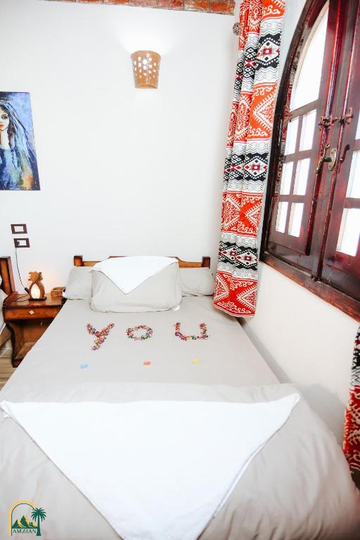 Postel nebo postele na pokoji v ubytování amzran hotel siwa