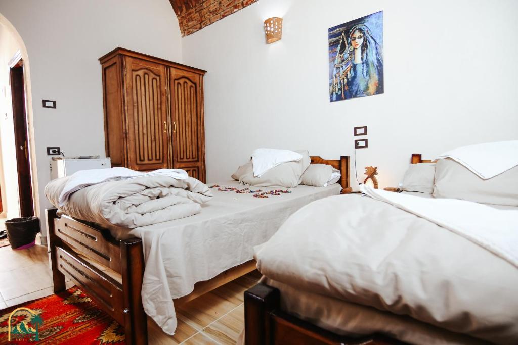 Postel nebo postele na pokoji v ubytování amzran hotel siwa