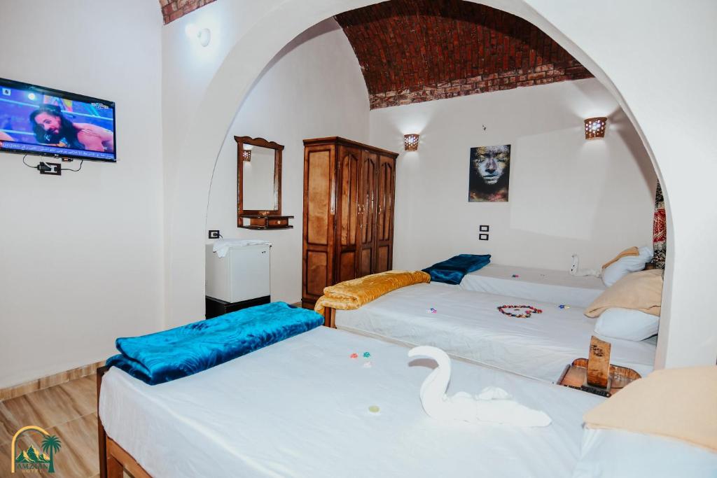 Postel nebo postele na pokoji v ubytování amzran hotel siwa