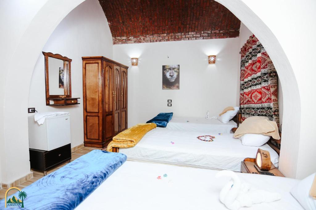 Postel nebo postele na pokoji v ubytování amzran hotel siwa