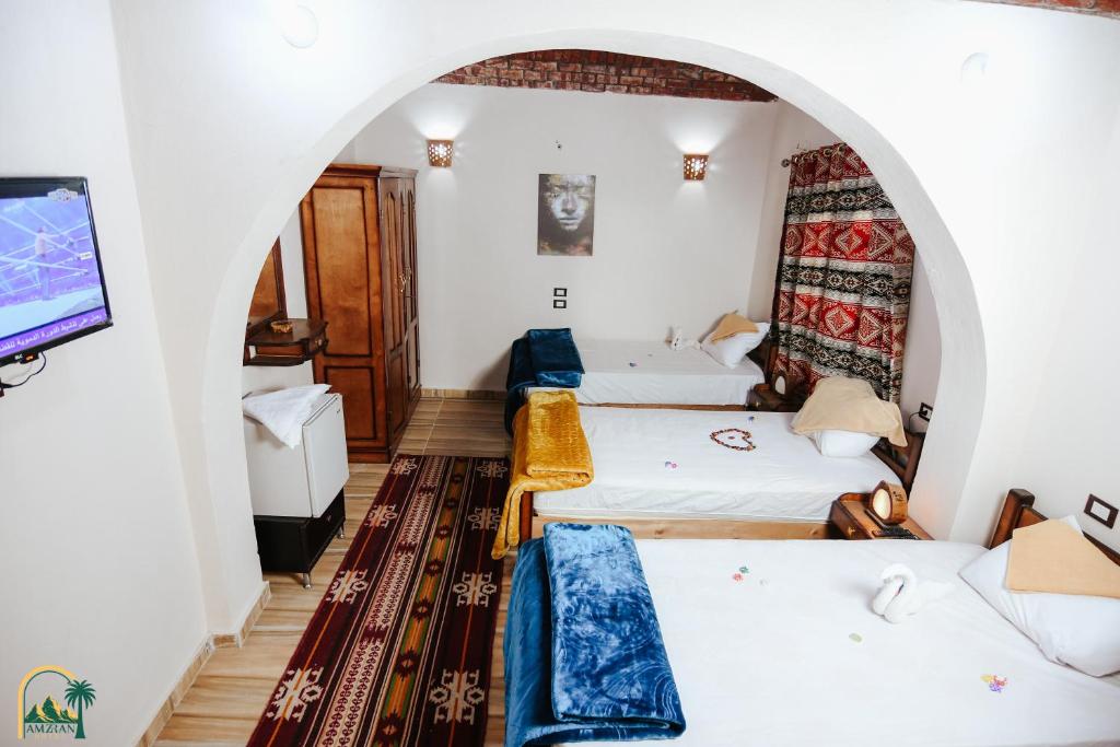 Postel nebo postele na pokoji v ubytování amzran hotel siwa