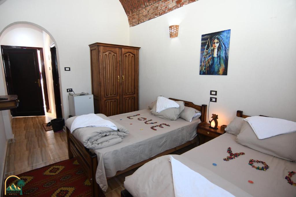 Postel nebo postele na pokoji v ubytování amzran hotel siwa