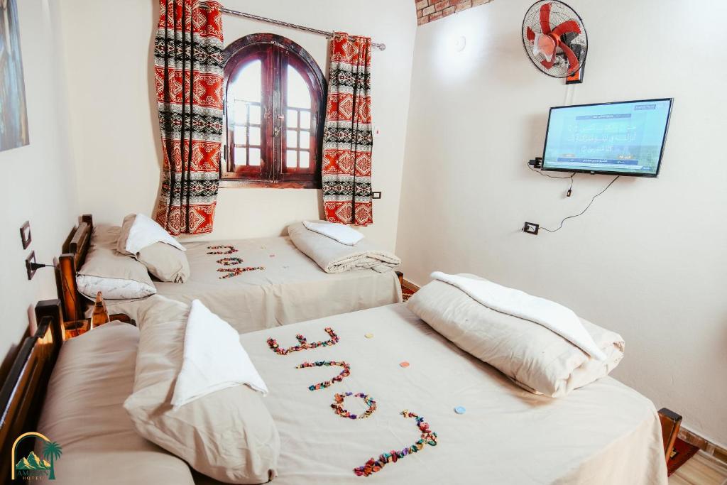 Postel nebo postele na pokoji v ubytování amzran hotel siwa