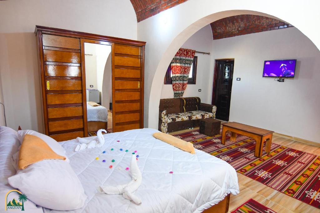 Postel nebo postele na pokoji v ubytování amzran hotel siwa