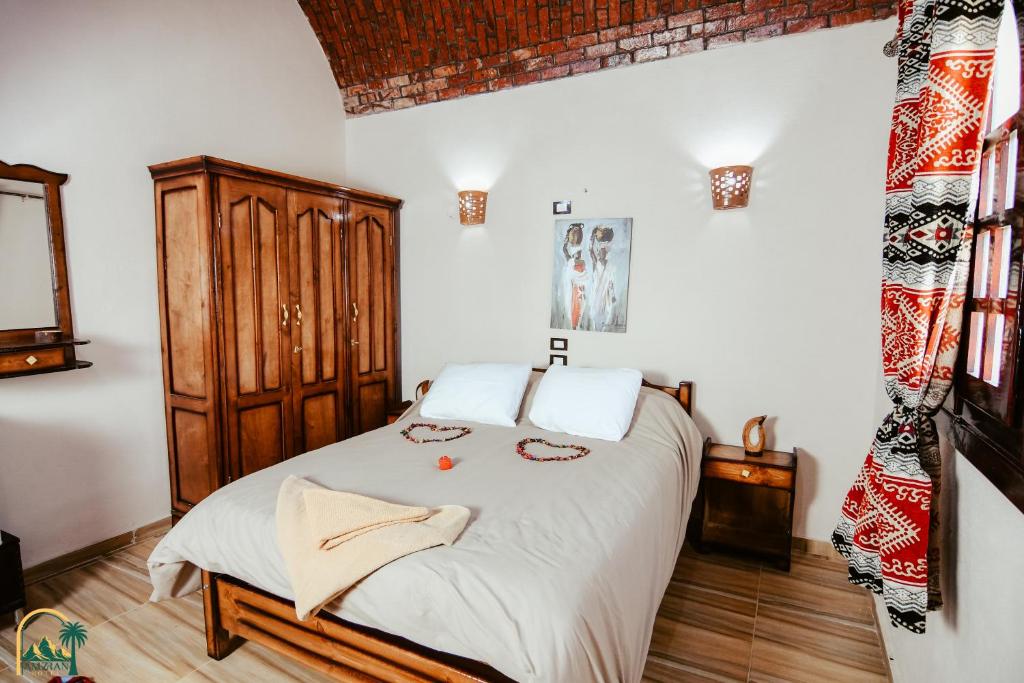 Postel nebo postele na pokoji v ubytování amzran hotel siwa