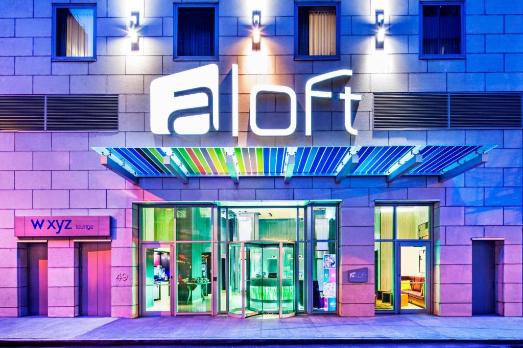 a building with an aloit sign on the side of it at Aloft Manhattan Downtown - Financial District in New York