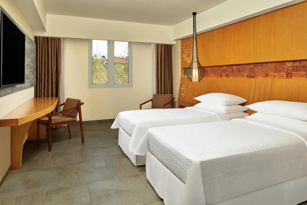 Letto o letti in una camera di Four Points by Sheraton Bali, Ungasan