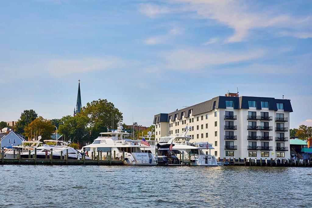 a large building with boats docked in the water at Annapolis Waterfront Hotel, Autograph Collection in Annapolis