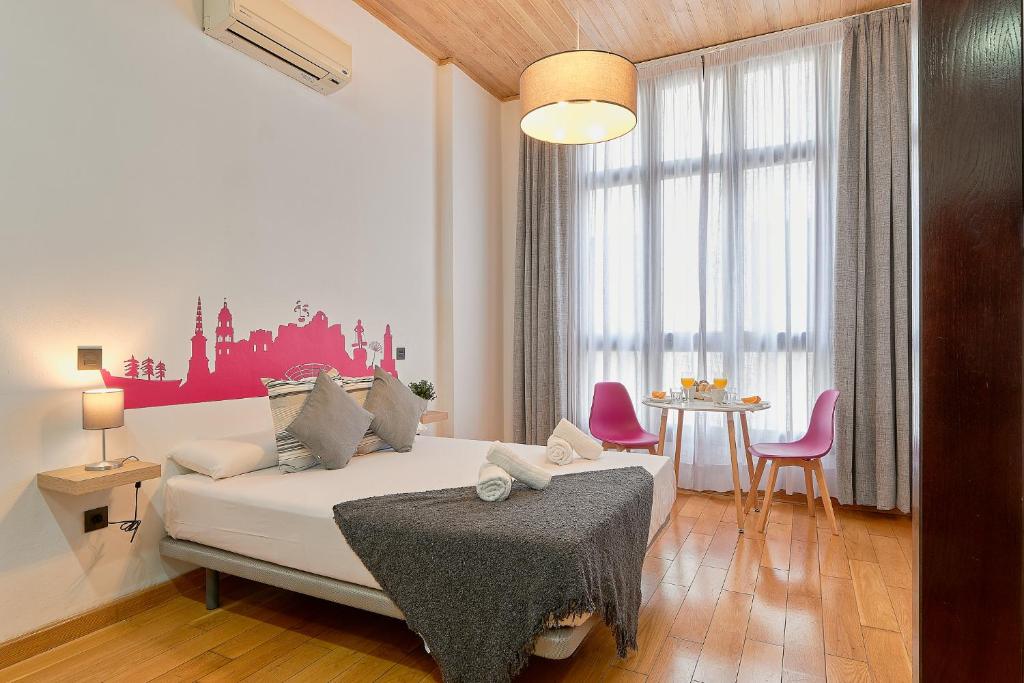 Posteľ alebo postele v izbe v ubytovaní Studio Urbanite