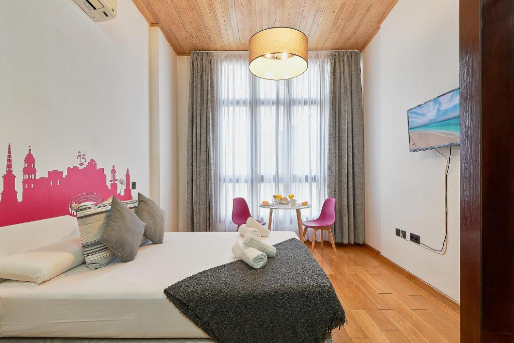 Posteľ alebo postele v izbe v ubytovaní Studio Urbanite