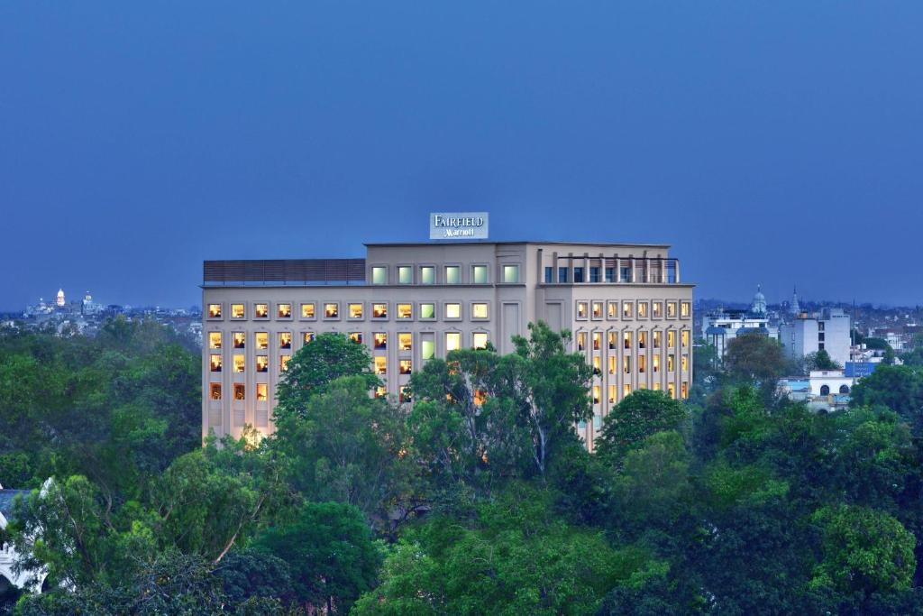 a large building with a sign on top of it at Fairfield by Marriott Amritsar in Amritsar