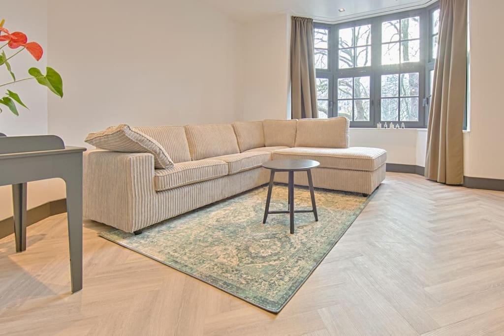 a living room with a couch and a table at PRIVATE APPARTMENT 60m2 - CENTRE TOP LOCATION in Amsterdam