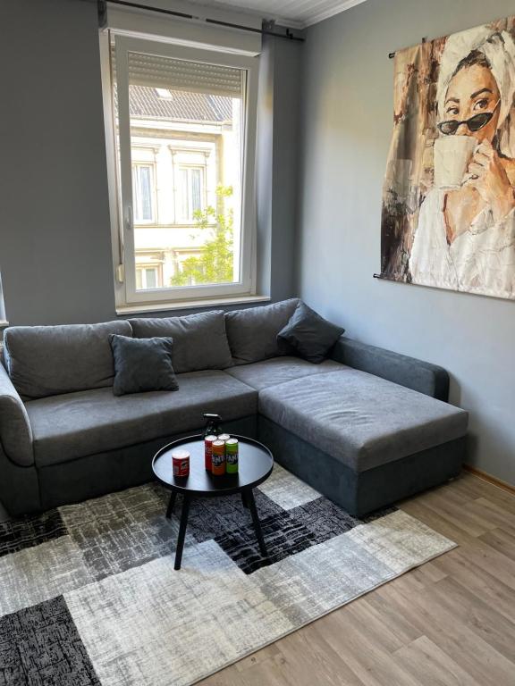 a living room with a couch and a table at Wohnung in Krefeld Zentrum, Nähe Hbf in Krefeld