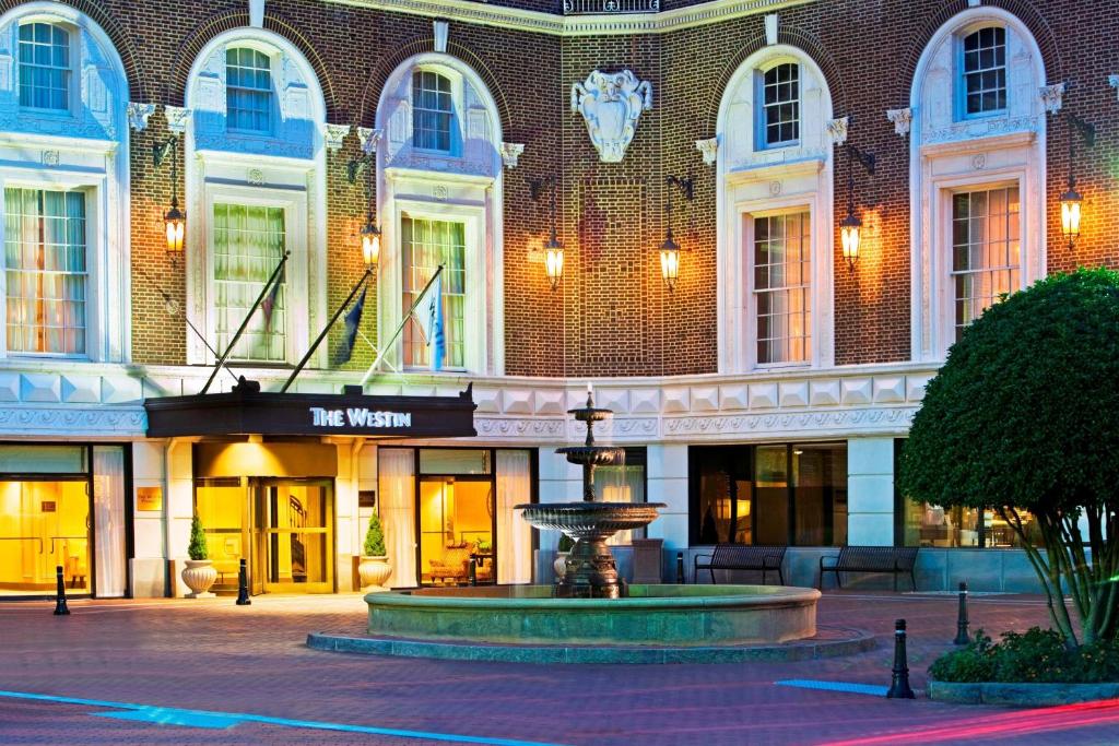 a building with a fountain in front of it at The Westin Poinsett, Greenville in Greenville