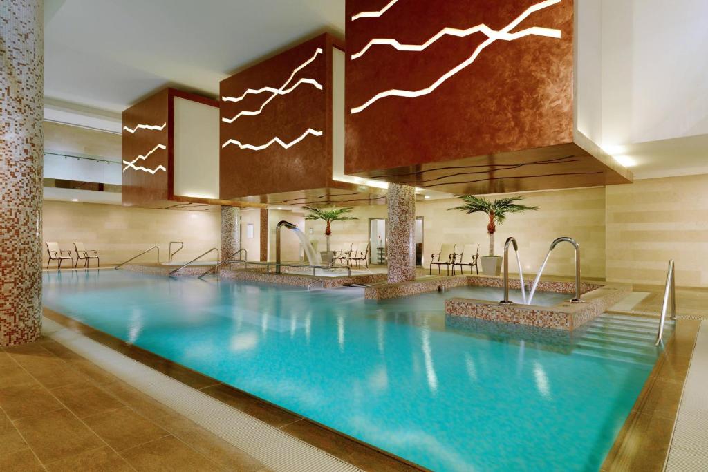 a large swimming pool in a hotel lobby at Sheraton Athlone Hotel in Athlone